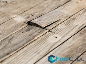 featured-image-damaged-timber-deck-board-timber-decking-should-i-repair-or-replace-my-timber-decking-floorcube-singapore